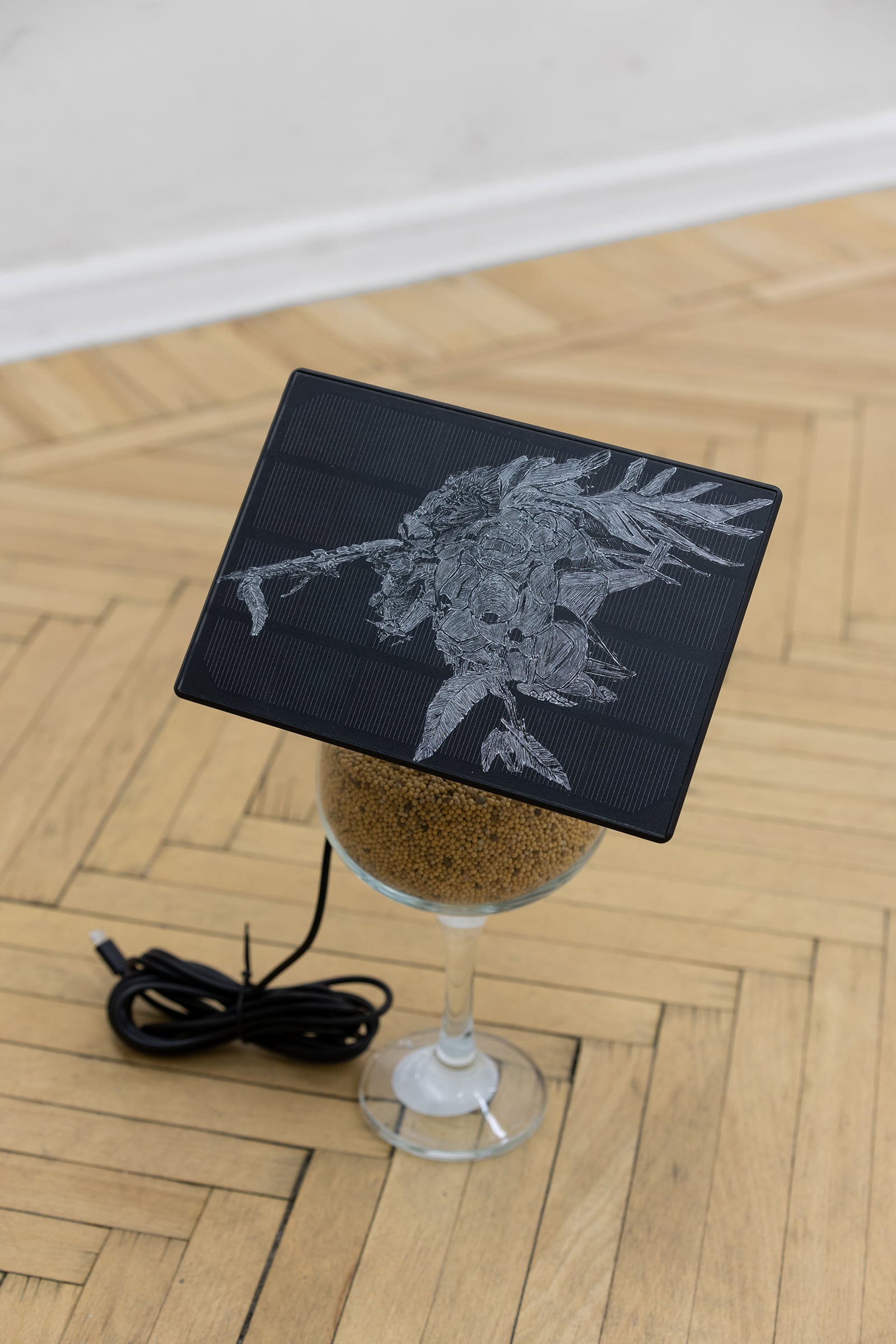 Ben Sang, Aeromorph 1, 2022, etching on solar panel, battery, wine glass, mustard seeds, dimensions vary