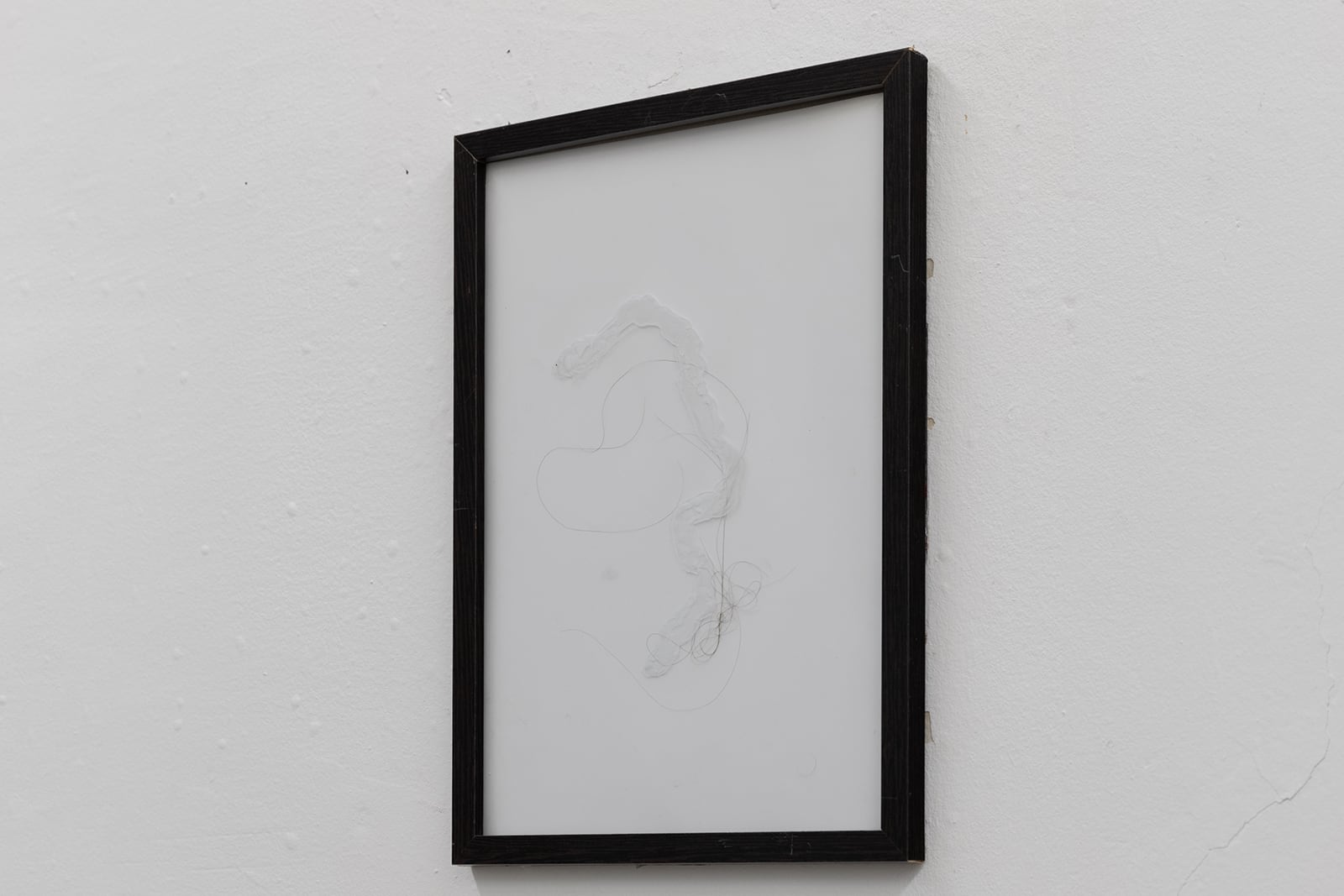 Vadim Murin, Untitled, 2019, artist frame with glass, silicone, male hair, 21 x 29 cm