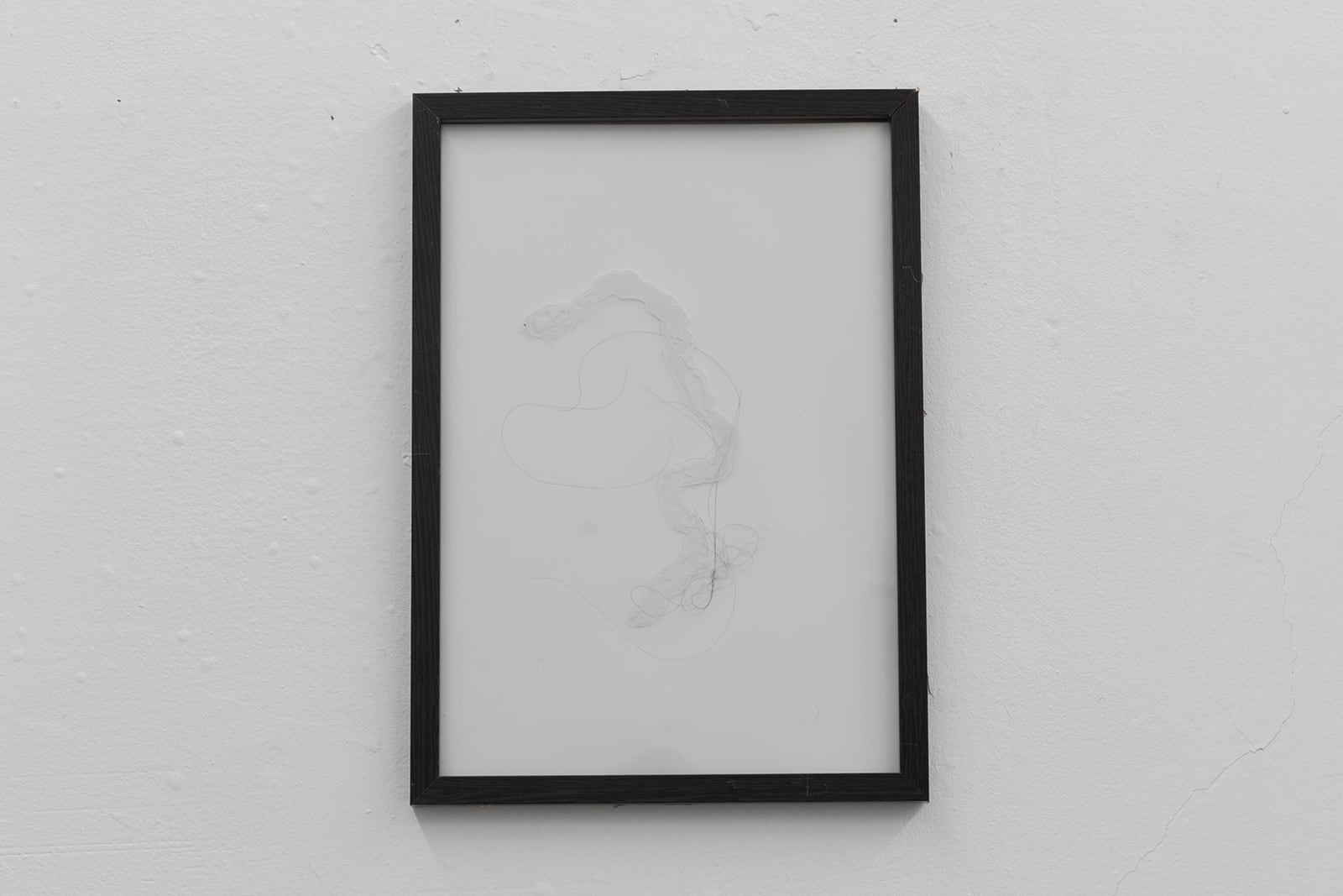 Vadim Murin, Untitled, 2019, artist frame with glass, silicone, male hair, 21 x 29 cm